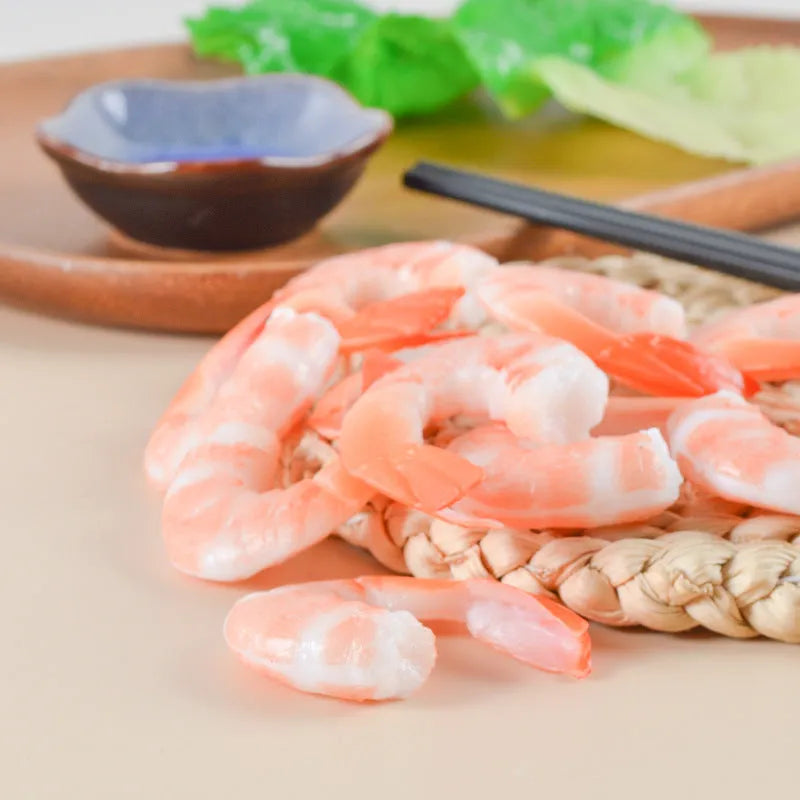 PVC injection moulded shrimp keychain with door buckle fastener on white background