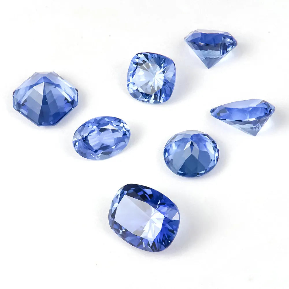 Royal blue love shaped tiara gemstone in heart and round cuts on a grey background.