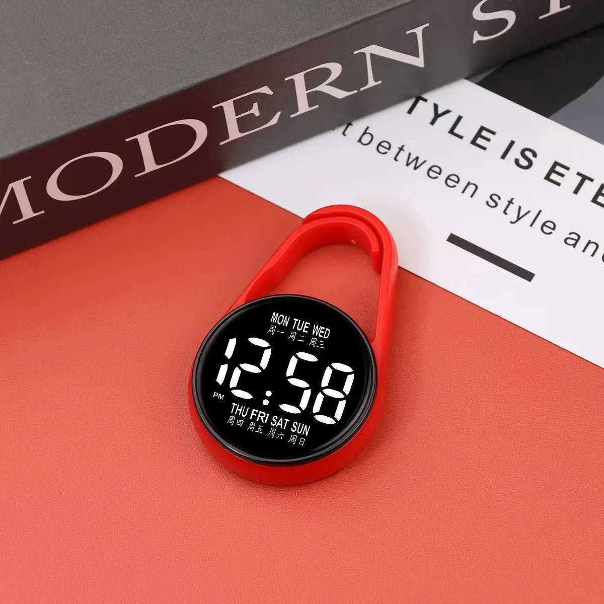 LED luminous electronic digital watch with plastic strap, shown in one of ten available colours on a wrist.