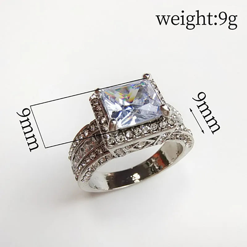 Geometric women's alloy ring in gold tone on a hand, showing round design element and UK size marking.