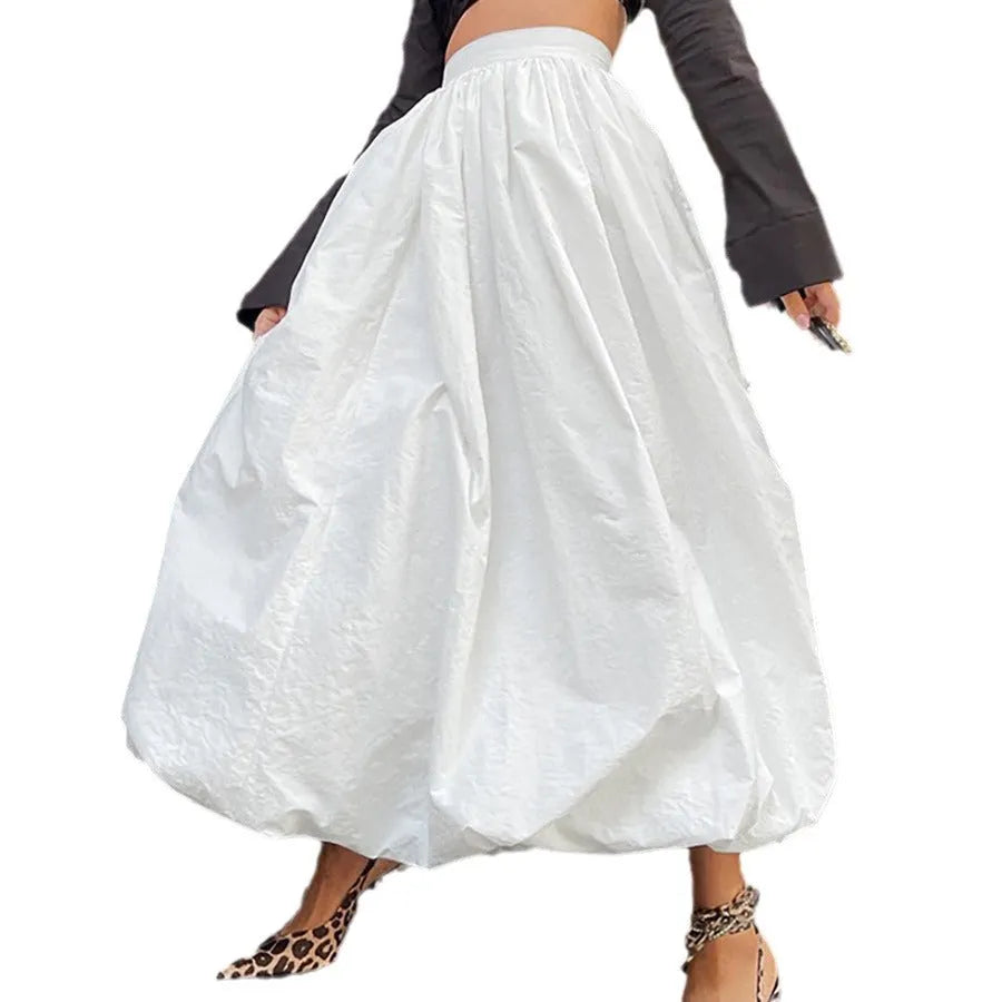 Women's solid colour long cotton skirt in black, shown with a structured fit suitable for casual or commute wear.