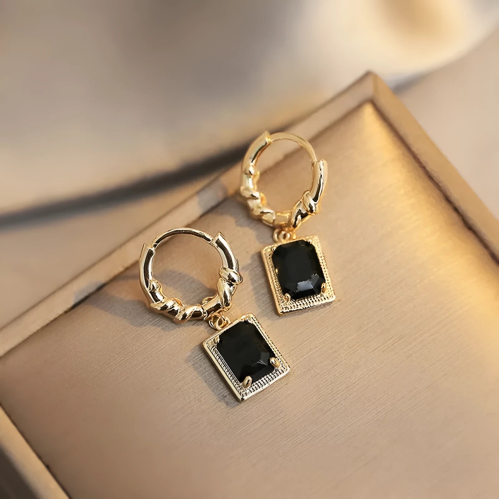 Copper geometric earrings with quadrilateral design in black zircon French court drop style