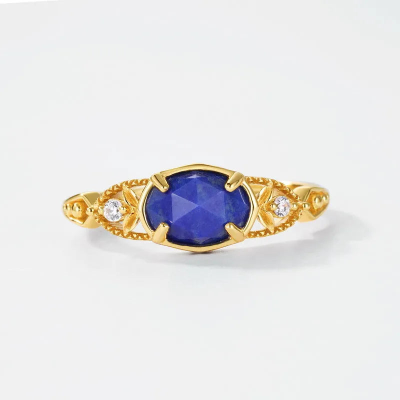 Oval geometric women's ring with a blue lapis lazuli stone in a silver alloy Japanese-style setting.