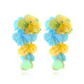 Handmade colourful bead flower and leaf drop earrings in an exaggerated oversized design.