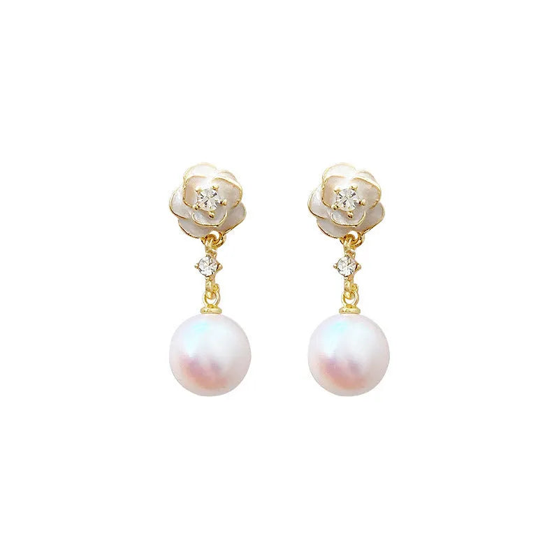 A pair of camellia flower-shaped stud earrings for women in a metallic alloy finish.