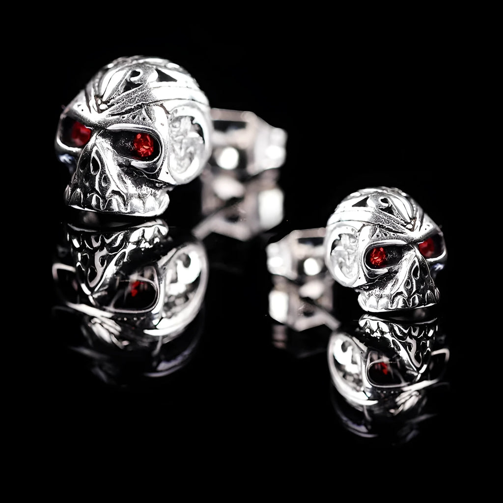 Retro skull stud earrings with red eye detailing and artificial gemstone inlay on alloy base