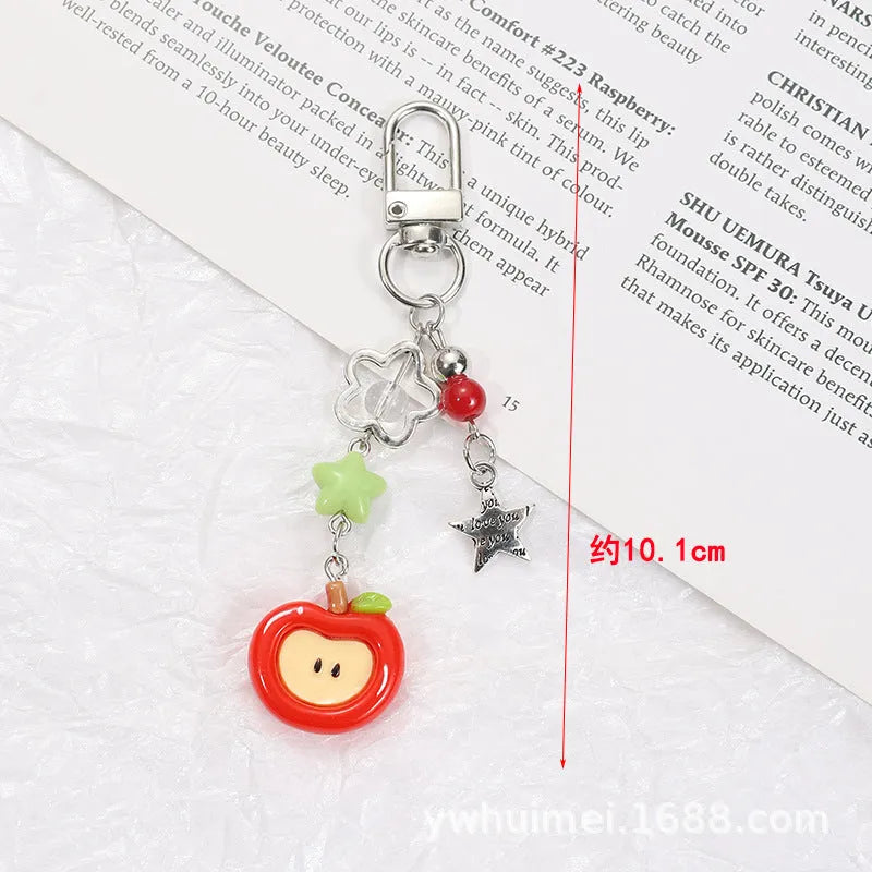 Plastic resin iPhone charm bag pendant keychain with fruit patterns including apple core and strawberry designs