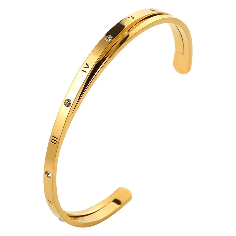 Open-ended stainless steel bracelet with inlaid zircon stones available in gold, rose, and steel colours