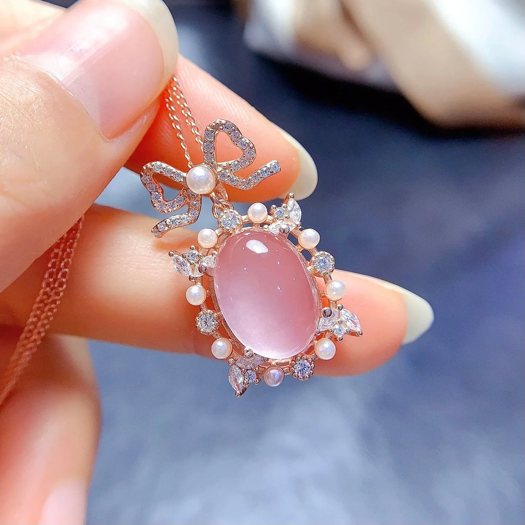 Geometric silver pendant with pink rose quartz crystal and rose gold plating on alloy chain
