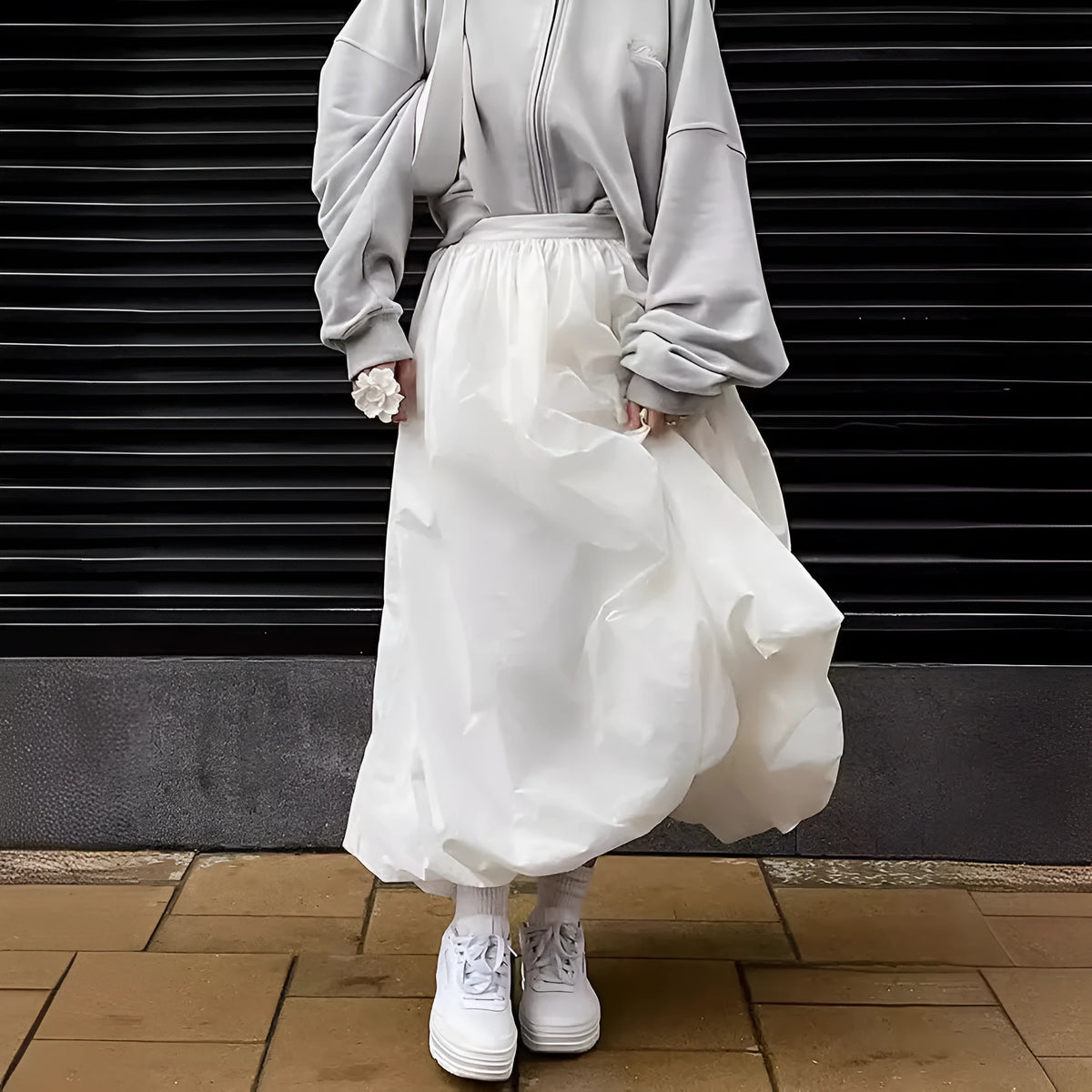 Women's solid colour long cotton skirt in black, shown with a structured fit suitable for casual or commute wear.