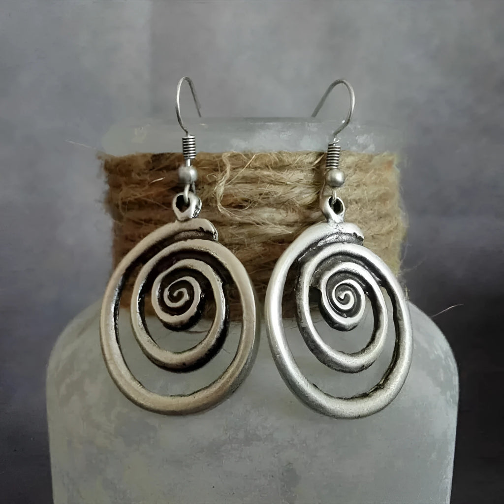 Geometric spiral distressed silver alloy earrings measuring 2.6 by 5 centimetres