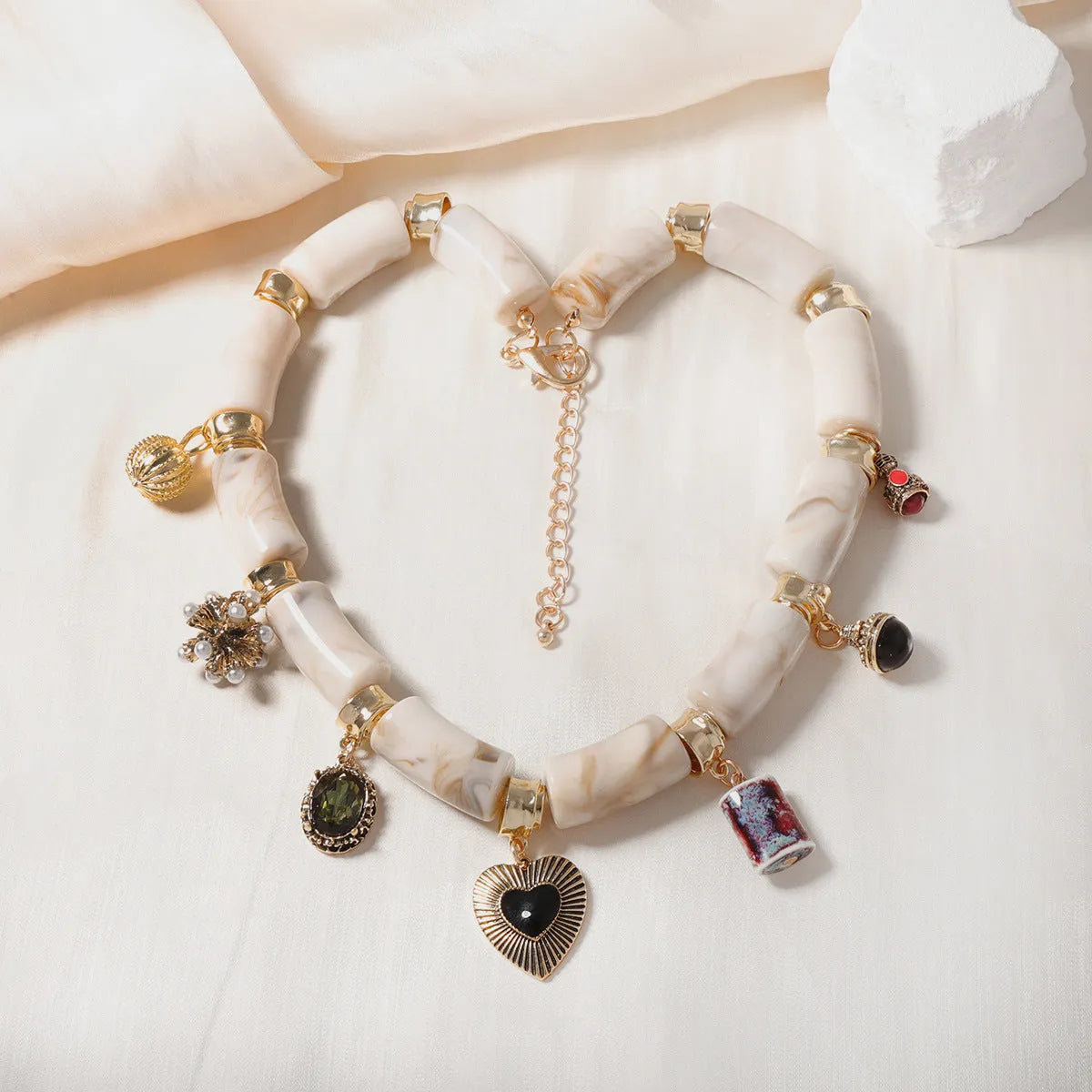 Heart shaped resin and bamboo pendant necklace with electroplated finish for women