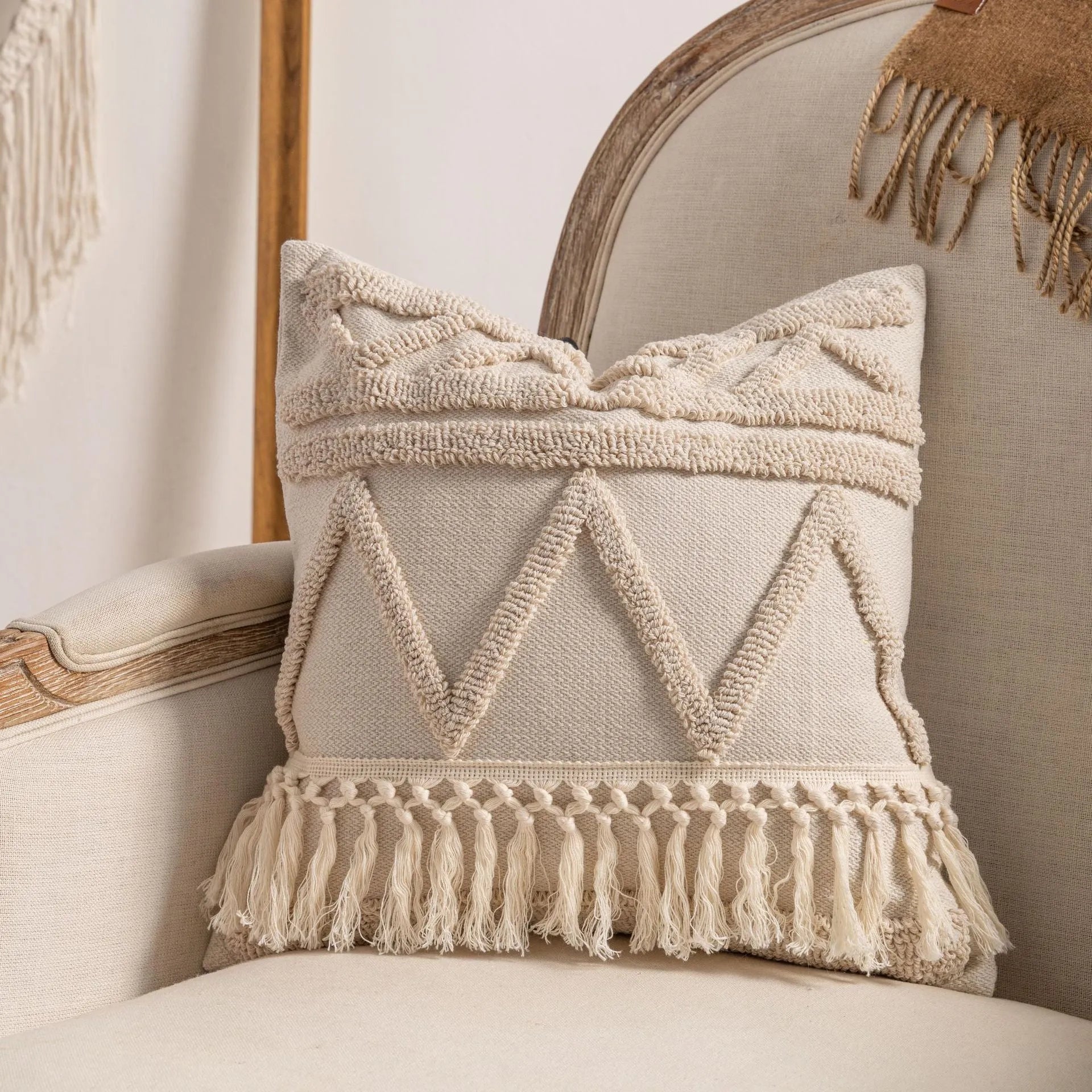 Knitted tassel pillow cover with striped pattern and bow design on home sofa