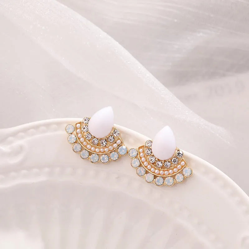 Retro silver fan-shaped earrings with needle opal and rhinestone geometric design