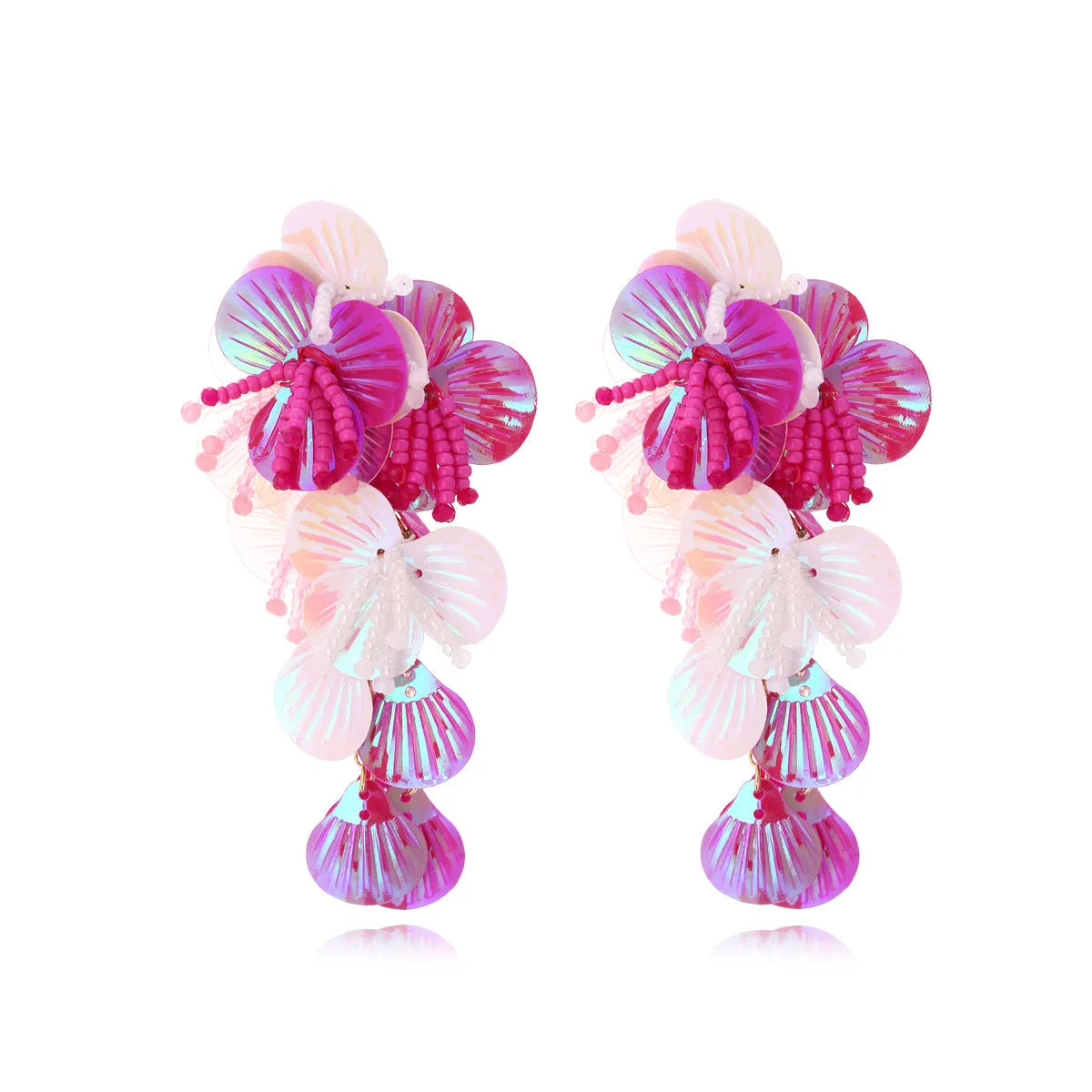 Handmade colourful bead flower and leaf drop earrings in an exaggerated oversized design.