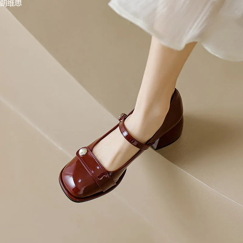 Women's patent leather chunky heel pumps with buckle closure and square toe