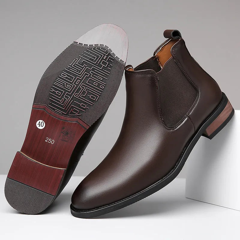 Men's black pointed-toe Chelsea ankle boot with a high-top silhouette and rubber sole.