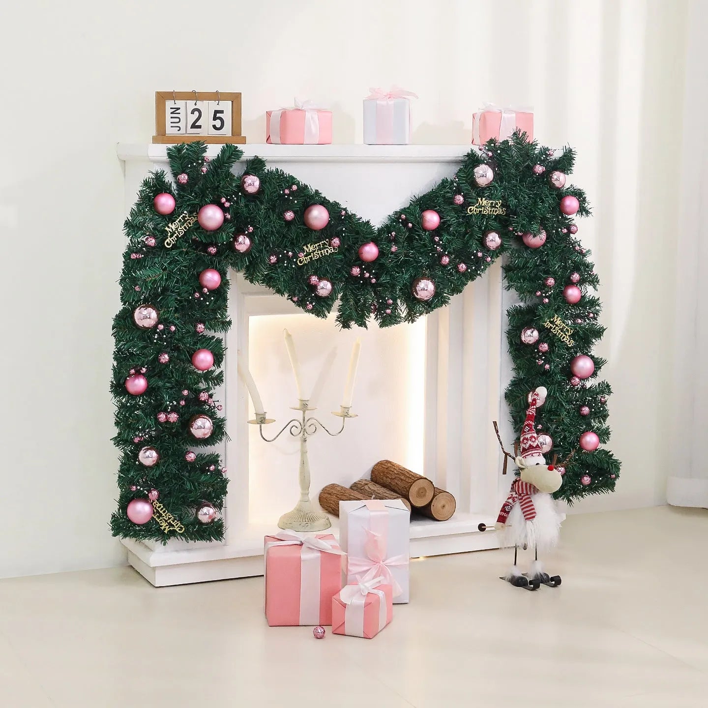 Long pink small fruit rattan Christmas garland draped over a stair bannister with optional LED lights