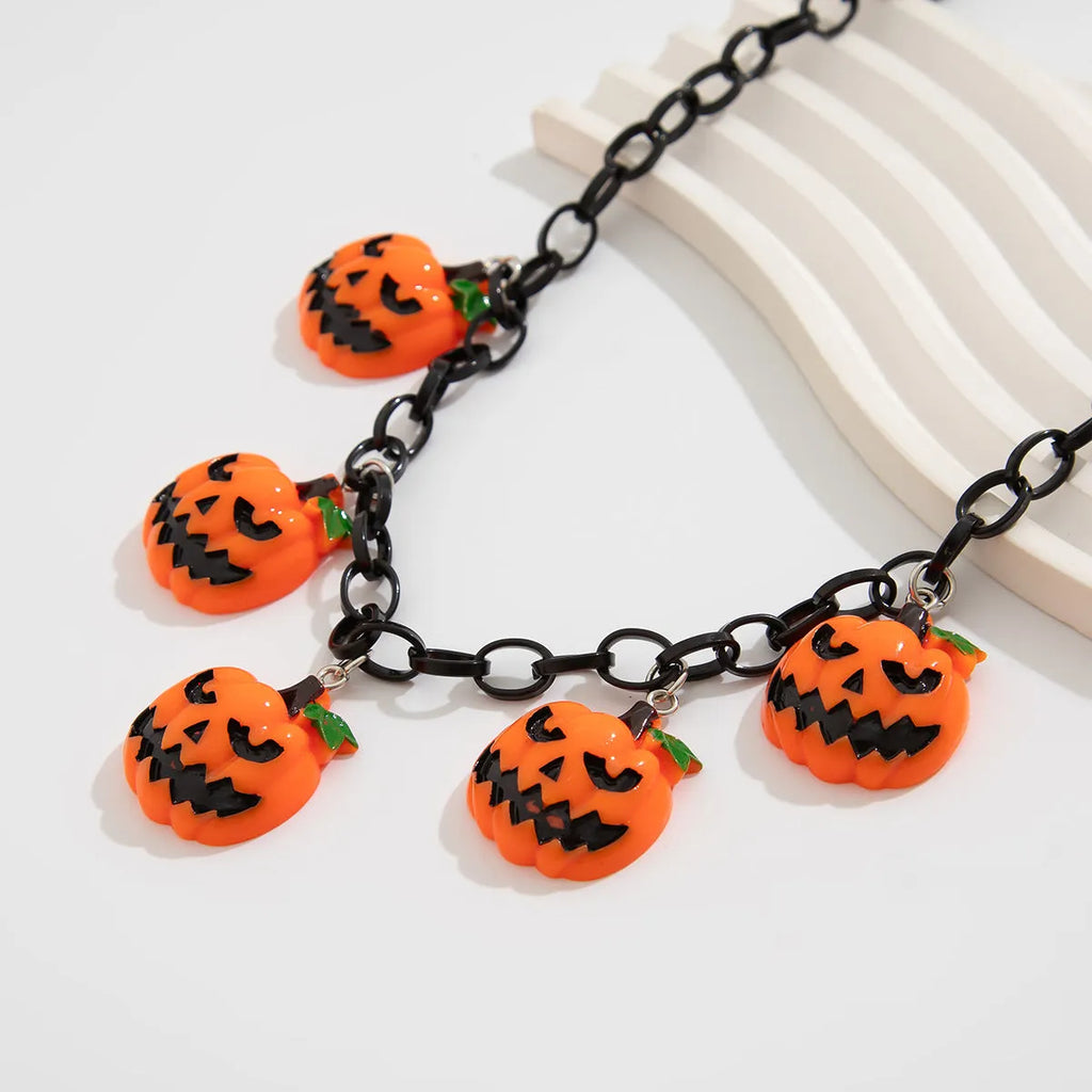 Mixed colour cartoon ghost and pumpkin acrylic pendant on a chain for Halloween.