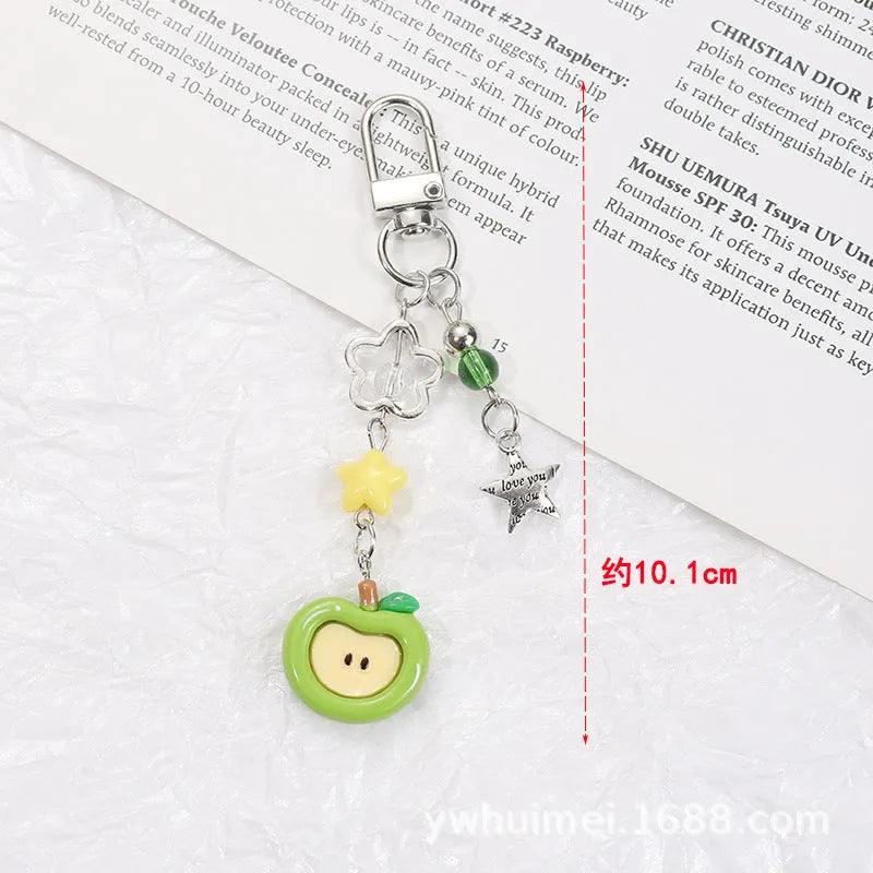 Plastic resin iPhone charm bag pendant keychain with fruit patterns including apple core and strawberry designs