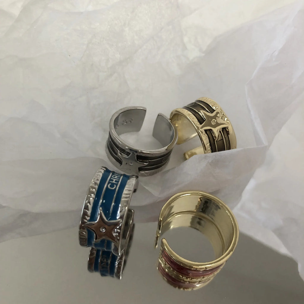 Adjustable geometric drop oil ring for women in distressed copper, shown in multiple colour options.