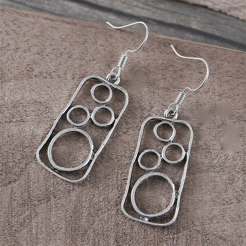 Geometric earrings with round ring and irregular square design in antique silver colour