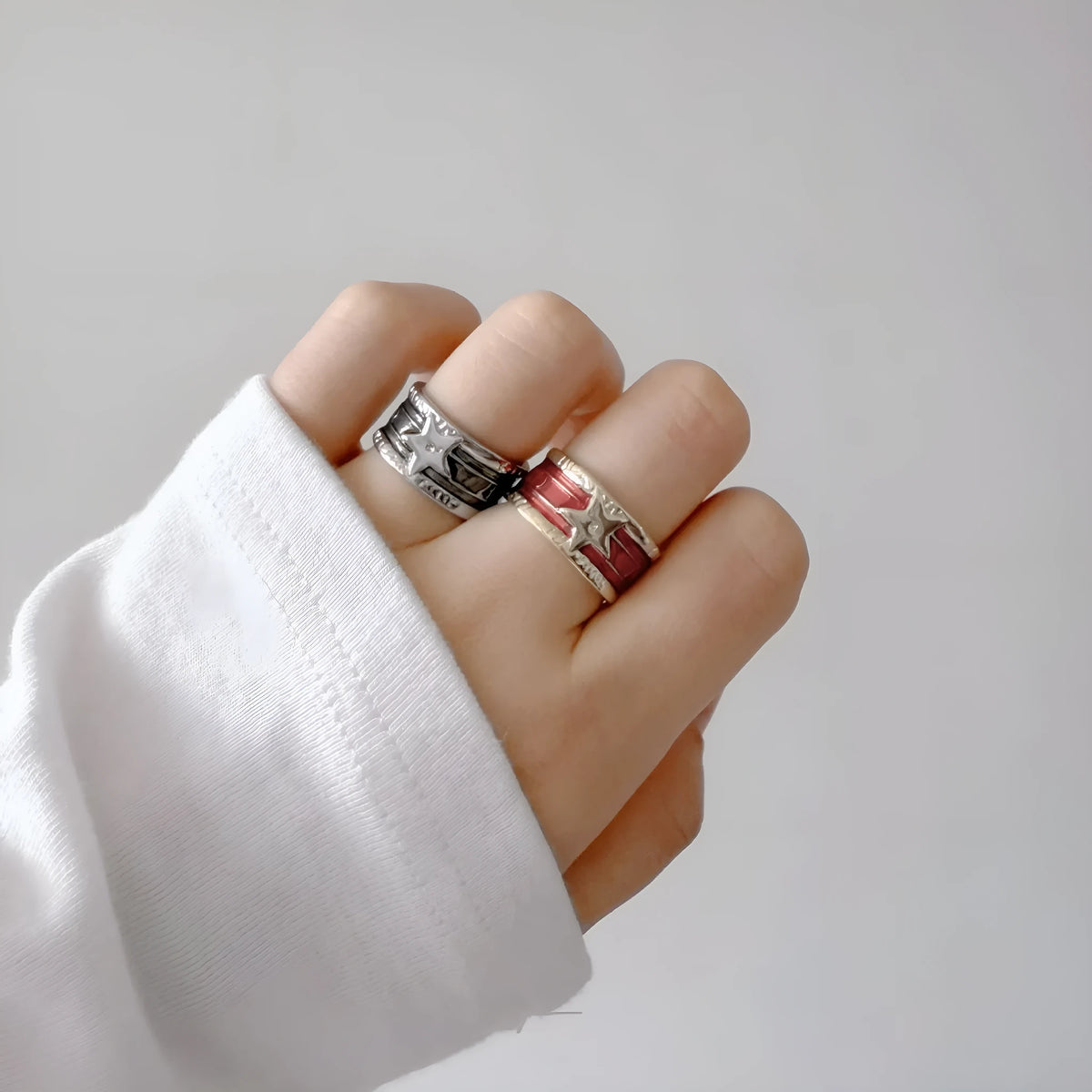 Adjustable geometric drop oil ring for women in distressed copper, shown in multiple colour options.