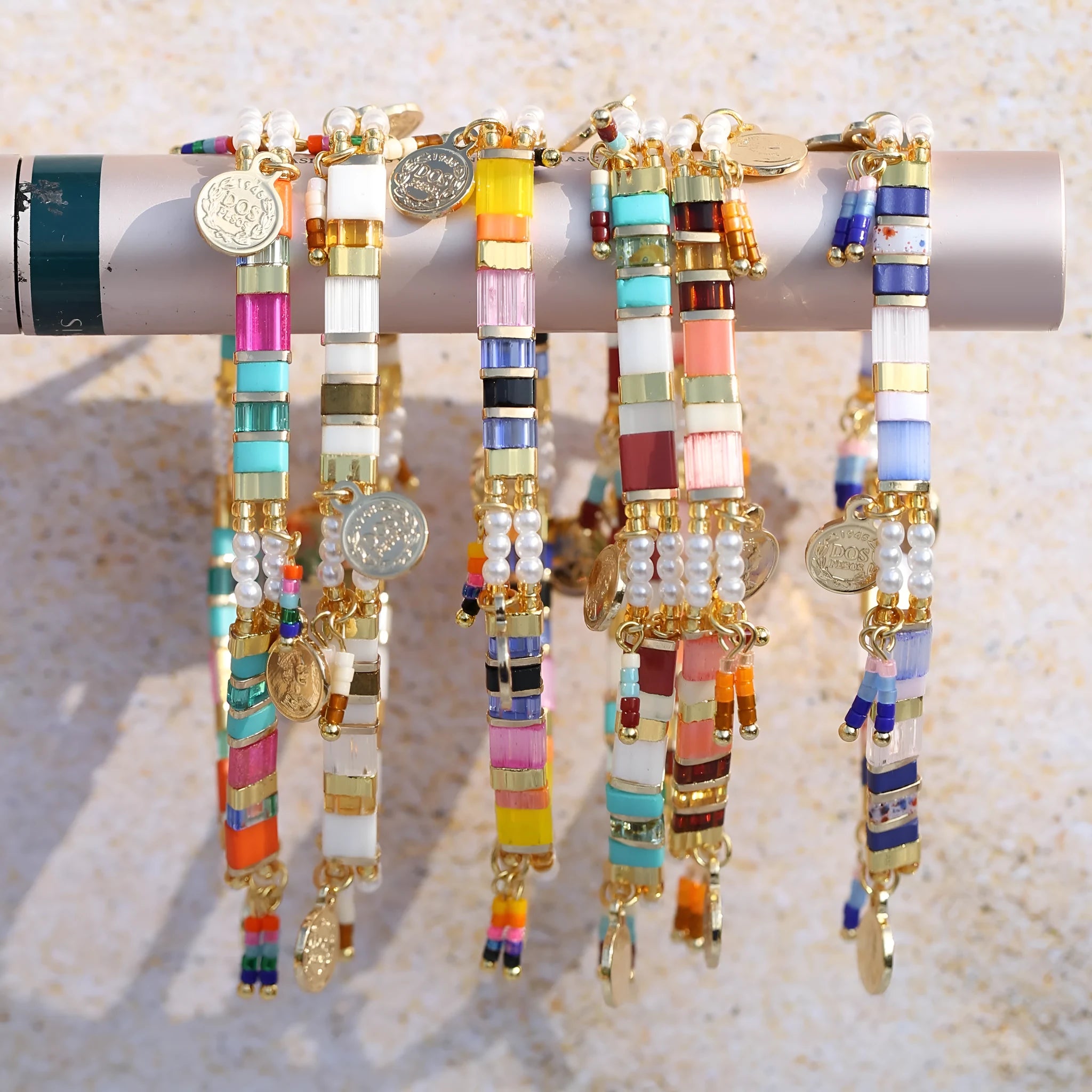 Women's glass coloured beaded bracelet with imitation pearl design showing six colour variations