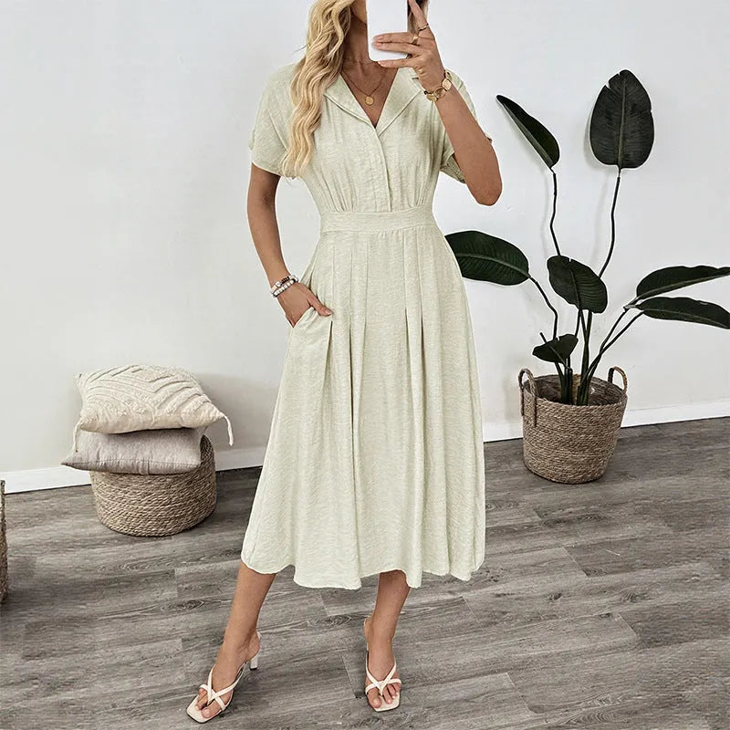 Light green lapel shirt dress with a waist tie and skirt pockets on a model.