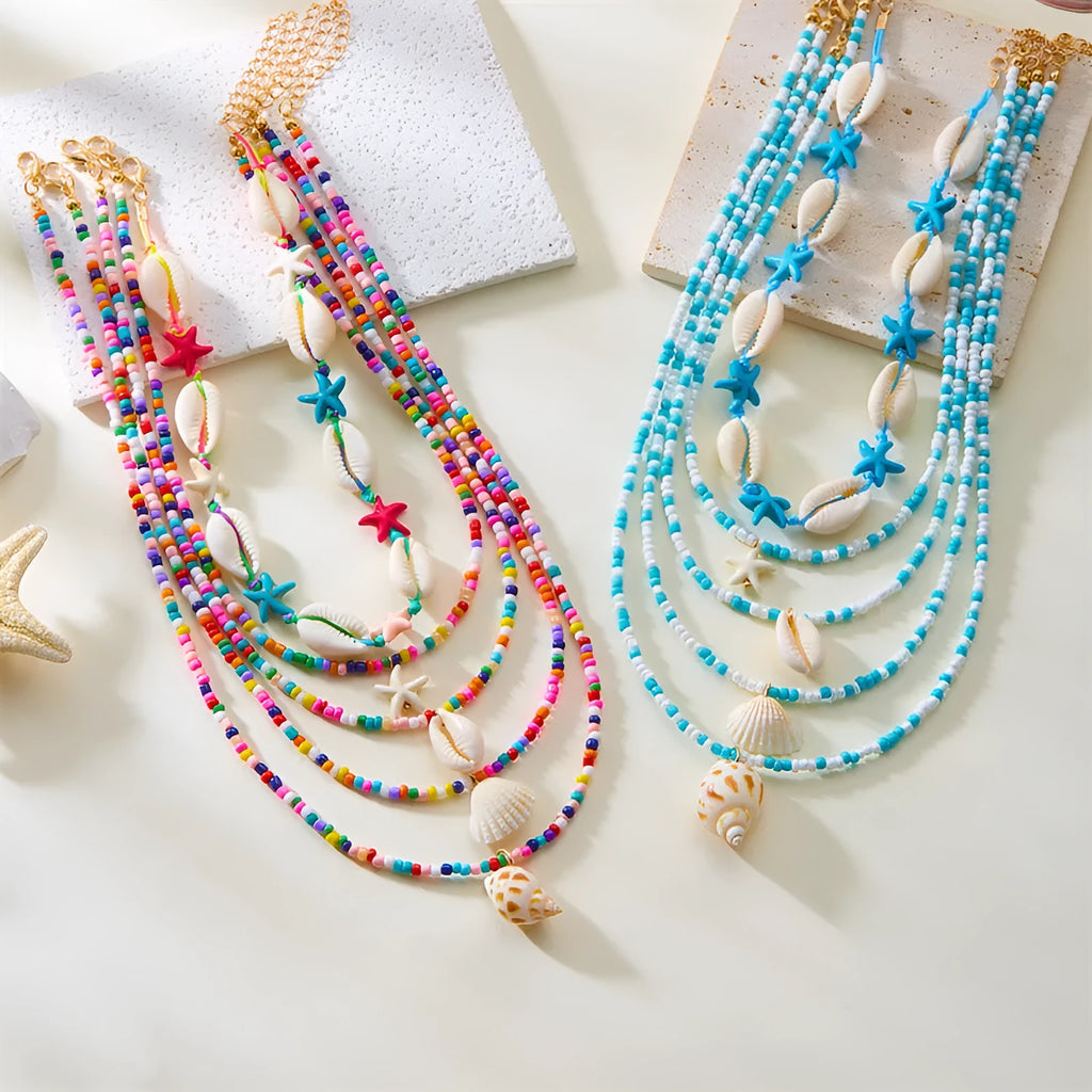 Women's multi-layer necklace set with starfish and shell bead pendants on adjustable chain