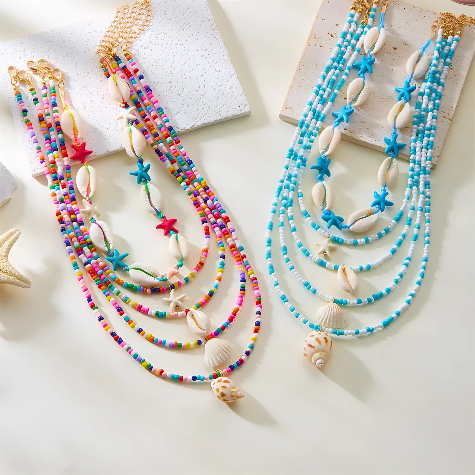 Women's multi-layer necklace set with starfish and shell bead pendants on adjustable chain