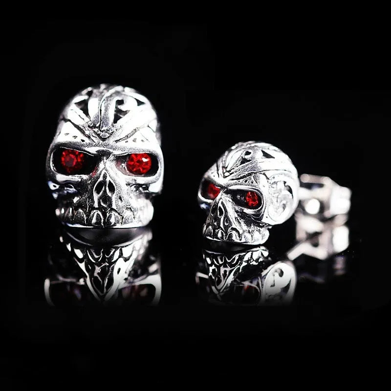 Retro skull stud earrings with red eye detailing and artificial gemstone inlay on alloy base