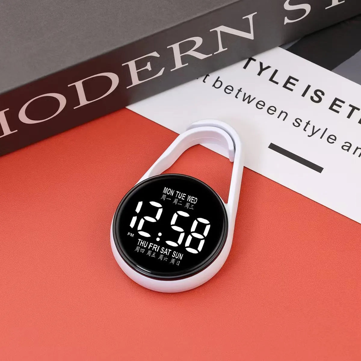 LED luminous electronic digital watch with plastic strap, shown in one of ten available colours on a wrist.