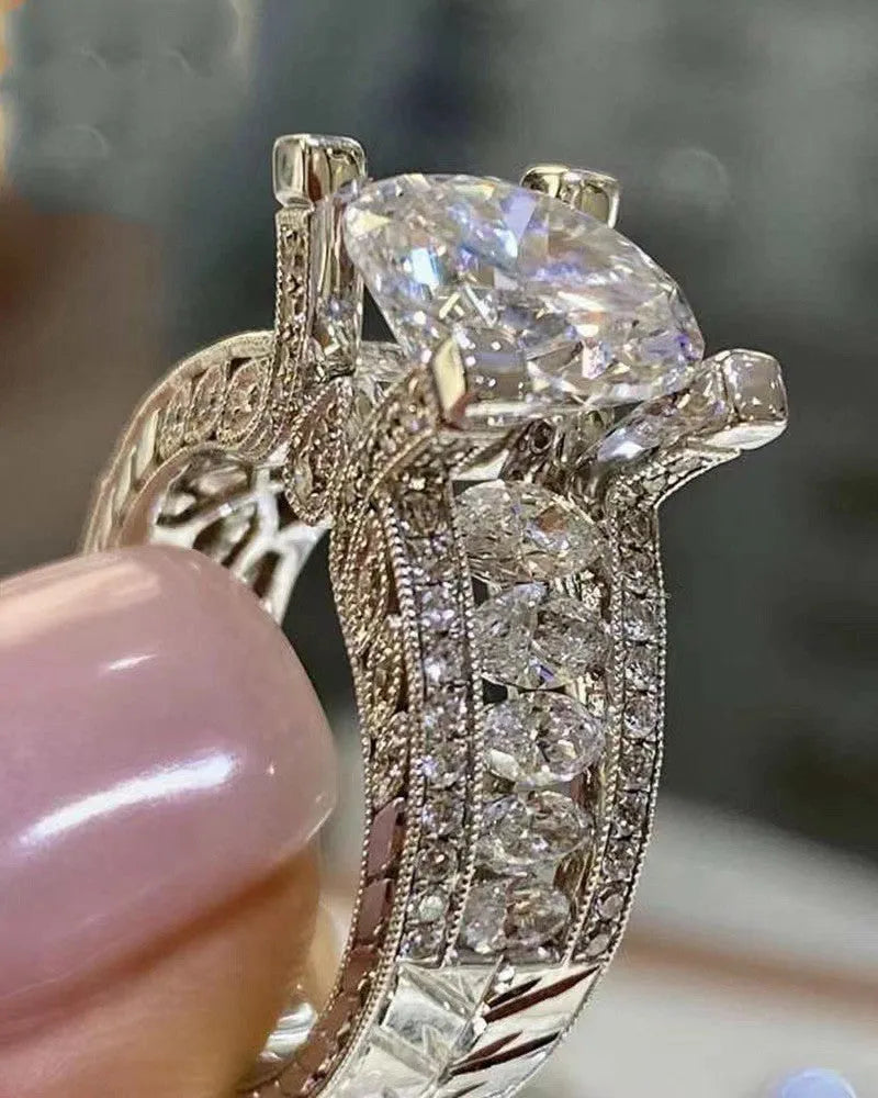 Geometric women's alloy ring in gold tone on a hand, showing round design element and UK size marking.