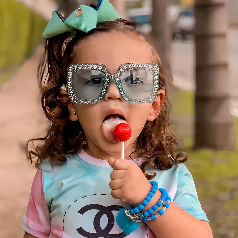 Plastic fashion sunglasses showing available colour options like black frame grey lens and pink frame pink lens.