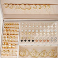 108 geometric alloy earrings with gold and yellow electroplated finishes arranged in combination set