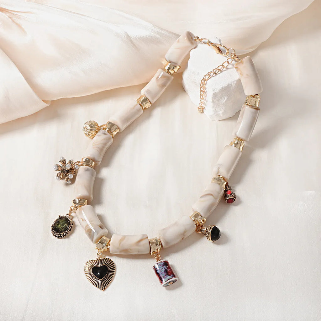Heart shaped resin and bamboo pendant necklace with electroplated finish for women