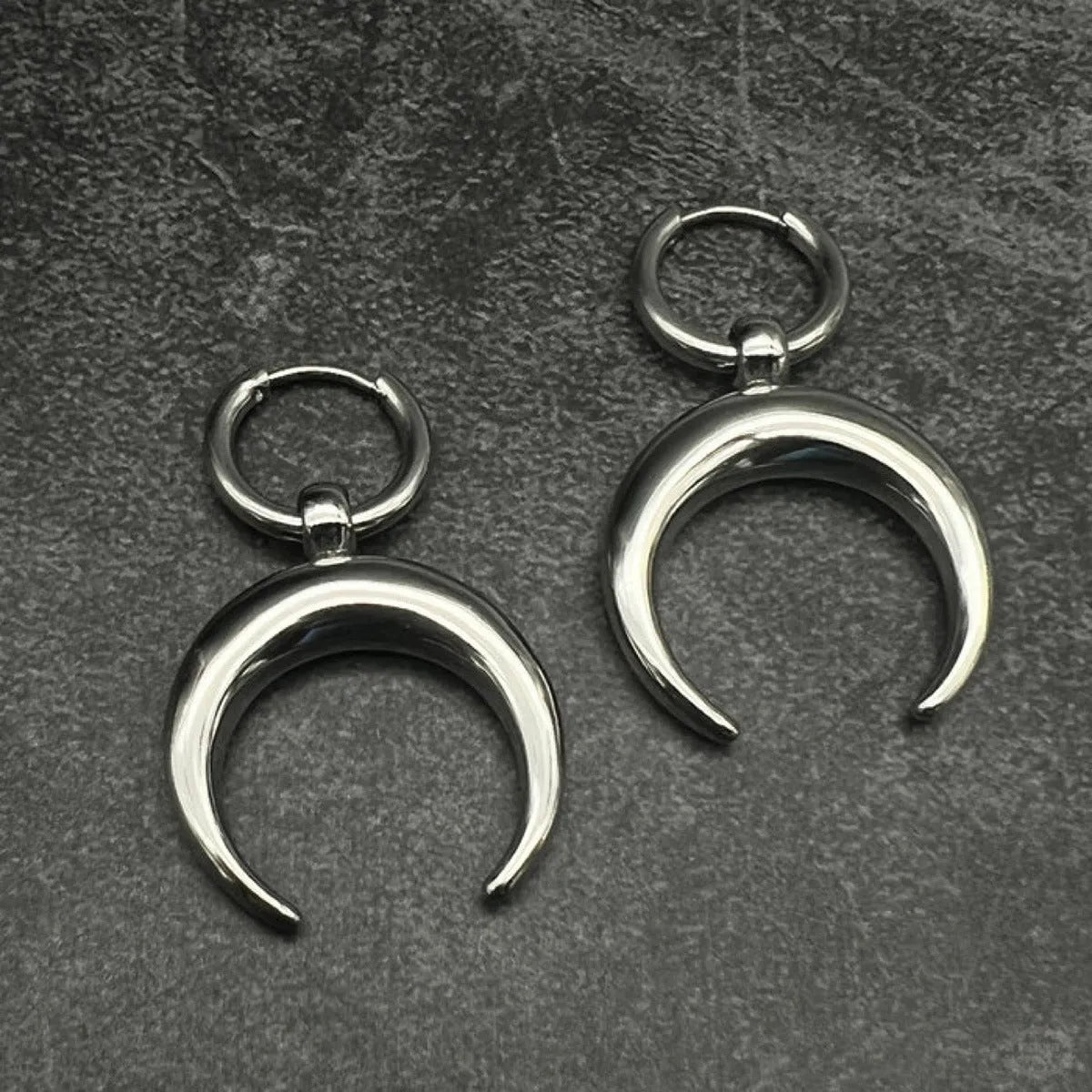 Silver alloy hoop earrings with moon detail and geometric shaping