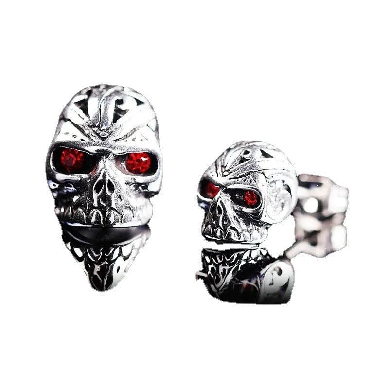 Retro skull stud earrings with red eye detailing and artificial gemstone inlay on alloy base