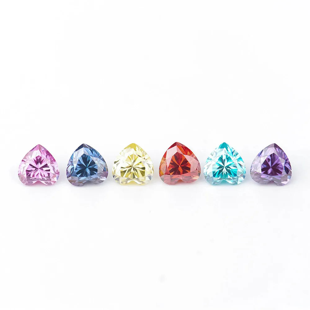 A colourful heart-shaped moissanite gemstone in various sizes and shades including lemon yellow, pink and sapphire blue.