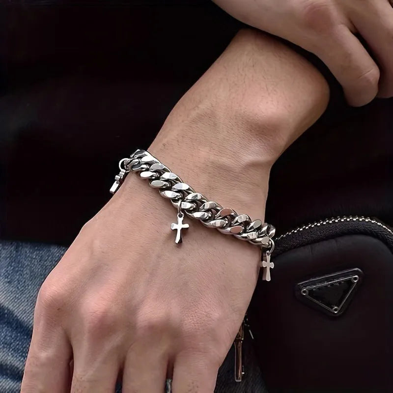 Men's titanium steel bracelet with a cross design and geometric shape on a wrist.