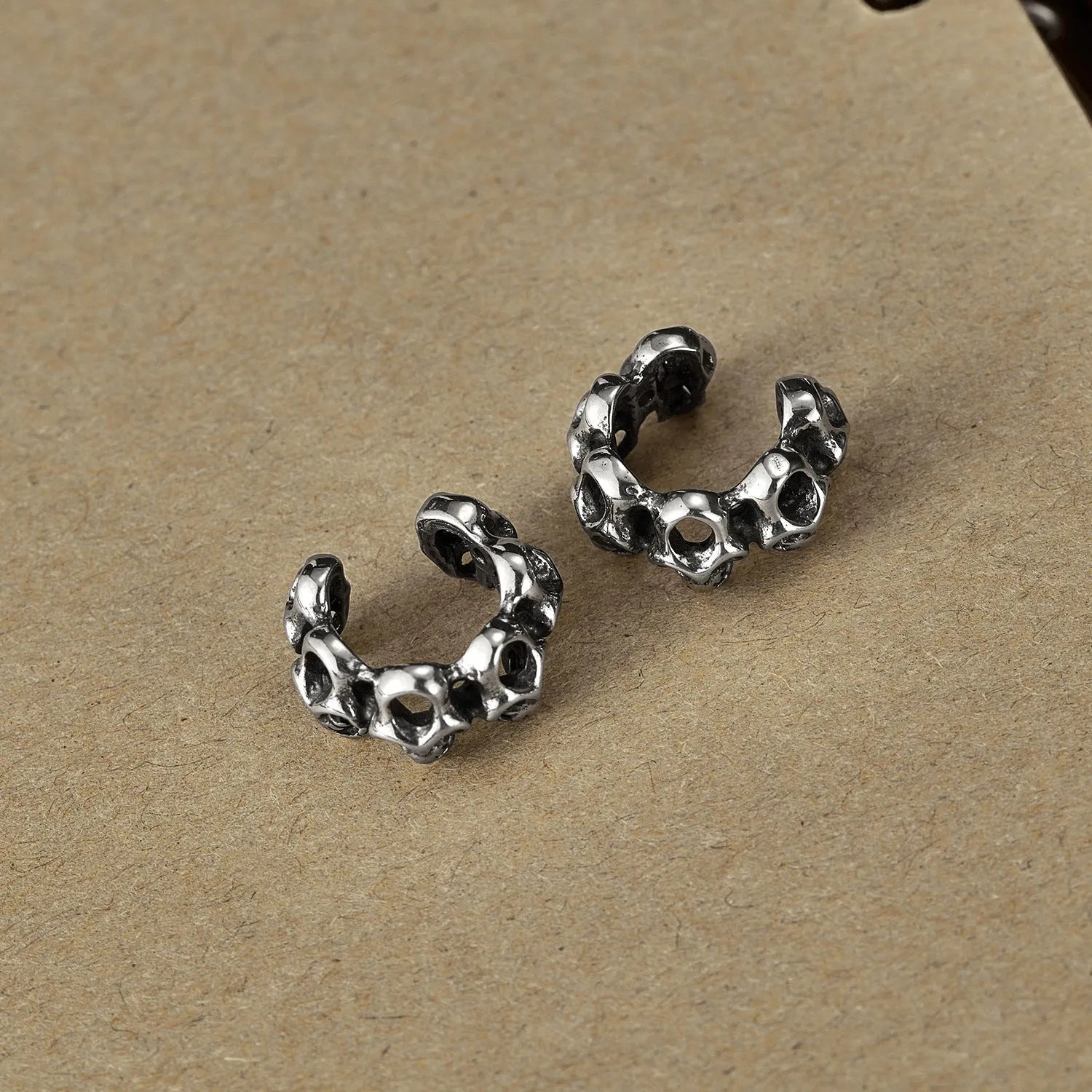 Silver stainless steel hollow skull ear clip with geometric retro design for unisex hip hop fashion