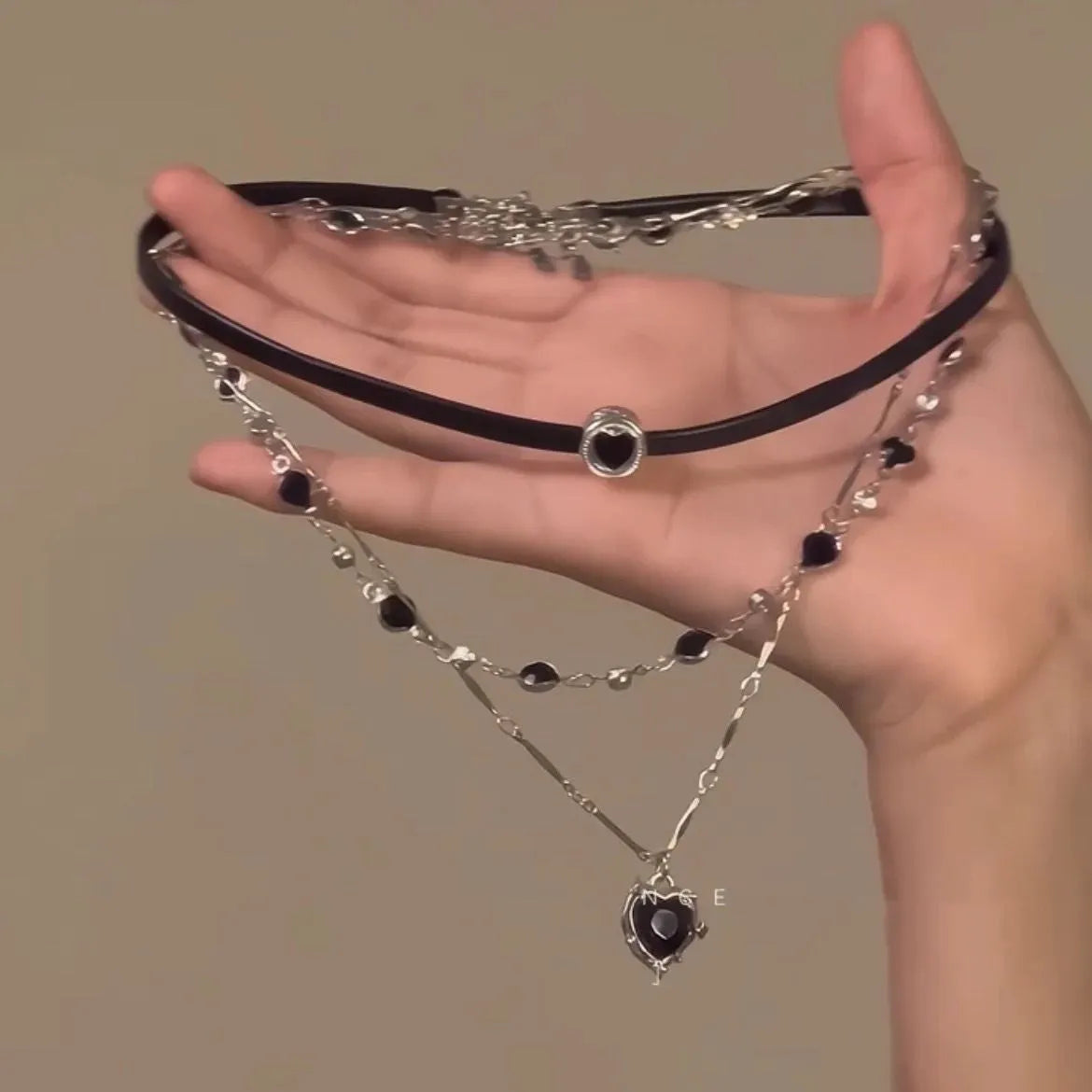 Women's multi-layer necklace set with leather heart designs and adjustable clavicle chain