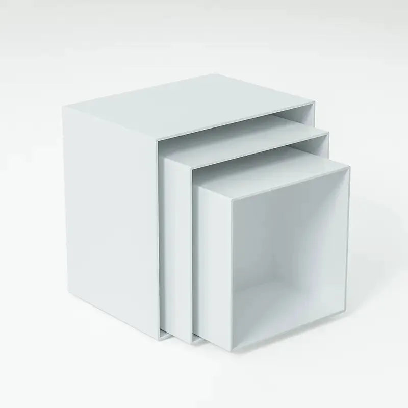 White plastic 6-piece interlocking cube dessert display stand showing tiered arrangement.