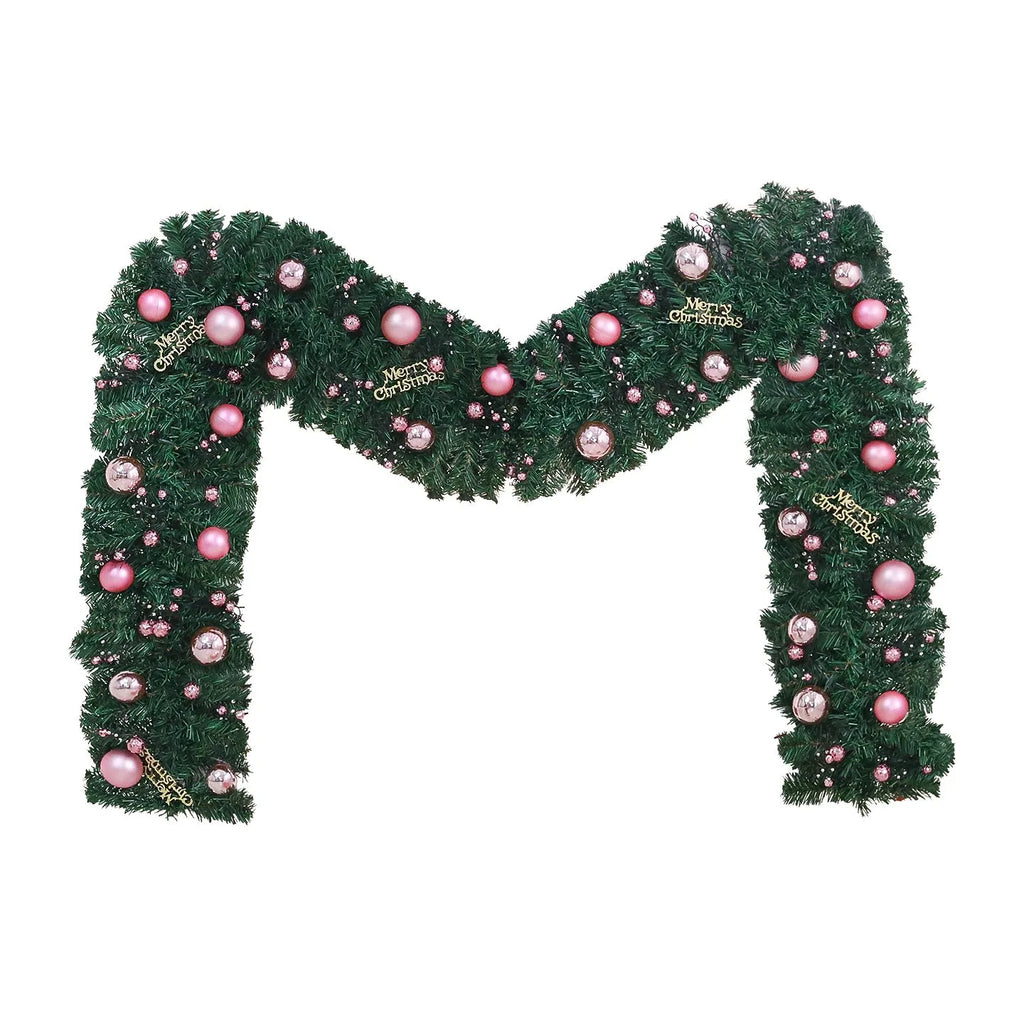 Long pink small fruit rattan Christmas garland draped over a stair bannister with optional LED lights