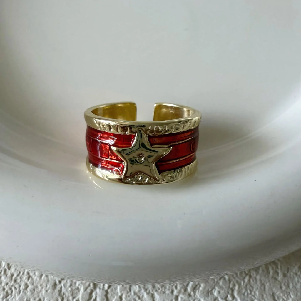 Adjustable geometric drop oil ring for women in distressed copper, shown in multiple colour options.
