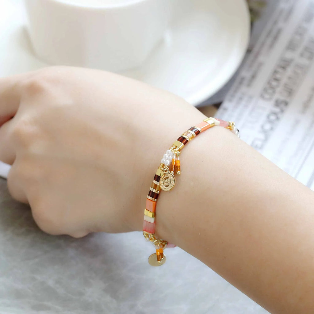 Women's glass coloured beaded bracelet with imitation pearl design showing six colour variations