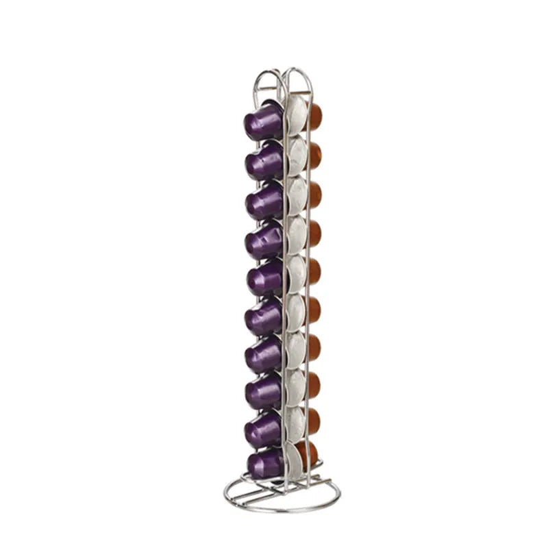 Black wrought iron coffee capsule storage rack holding pods on display shelves.