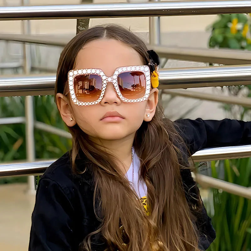 Plastic fashion sunglasses showing available colour options like black frame grey lens and pink frame pink lens.