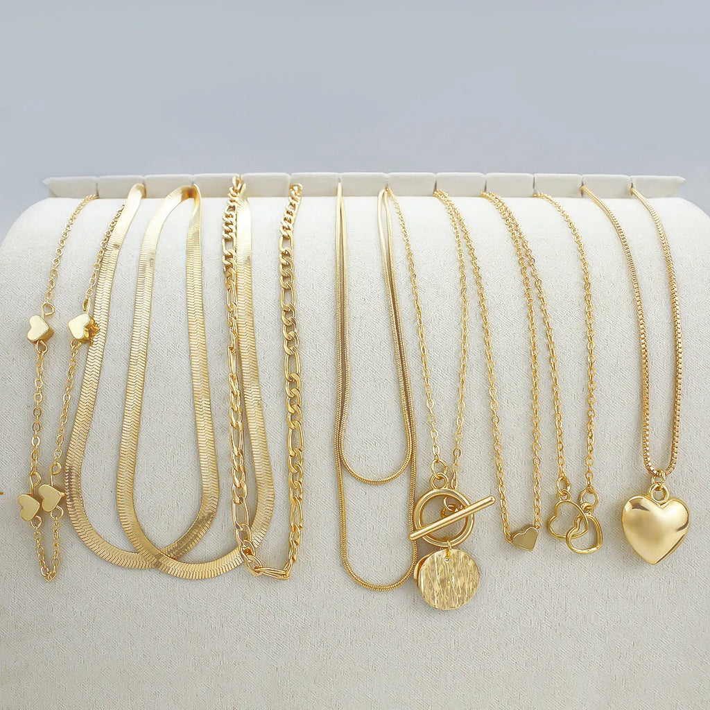 Gold electroplated women's necklace set with 10 jewellery ornaments on snake bone chain